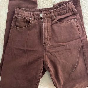 Brown jeans with one rip